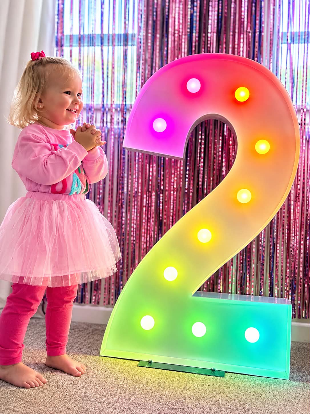 Colourful light up number 2 at a birthday celebration