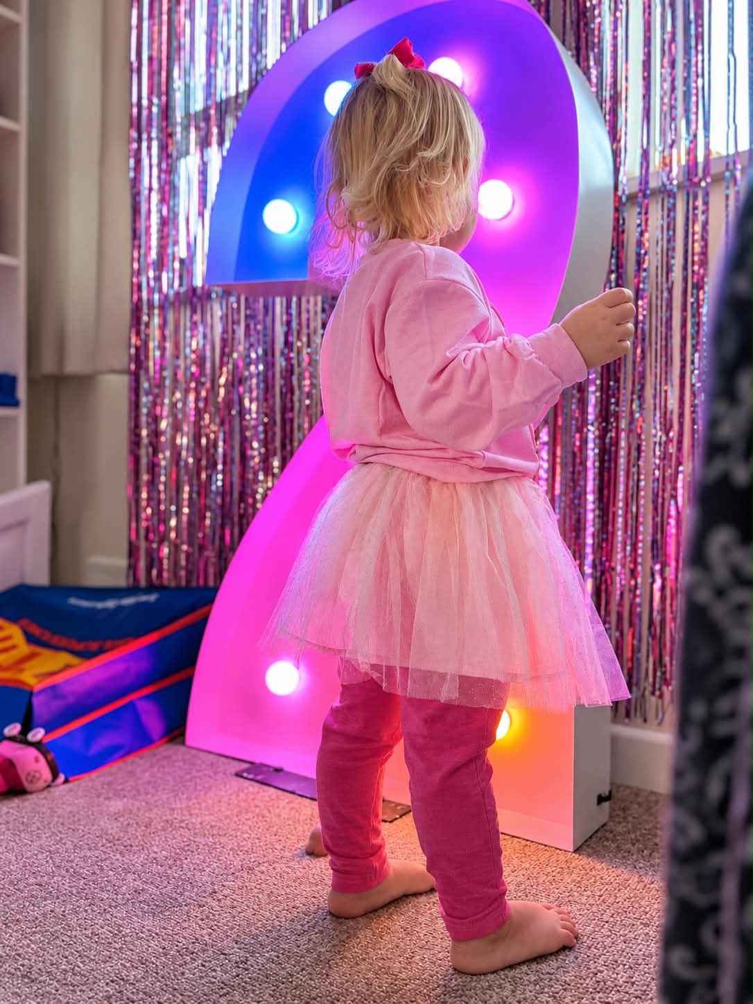 Light up birthday numbers displayed at a party